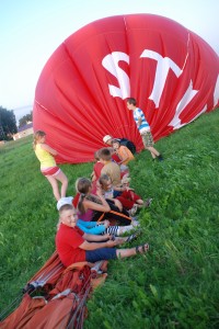 Childrens helping pressing air out of the balloon, Vilnius 09