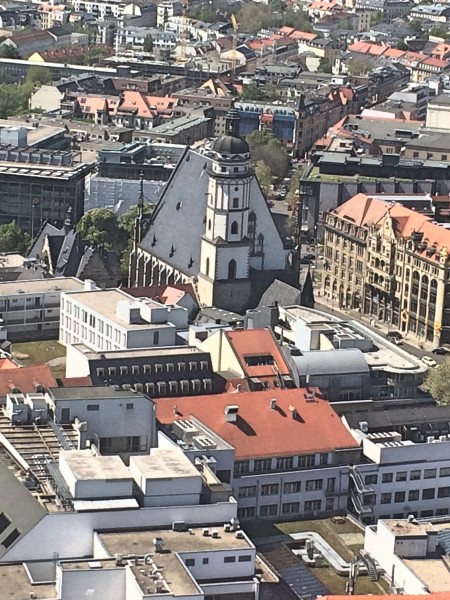 A great view over Leipzig city center with St. Thomas Church dominant in the center, What we dont see from this angel, is that in fact in front of the Church is a beautiful garden with threes (see small photo)